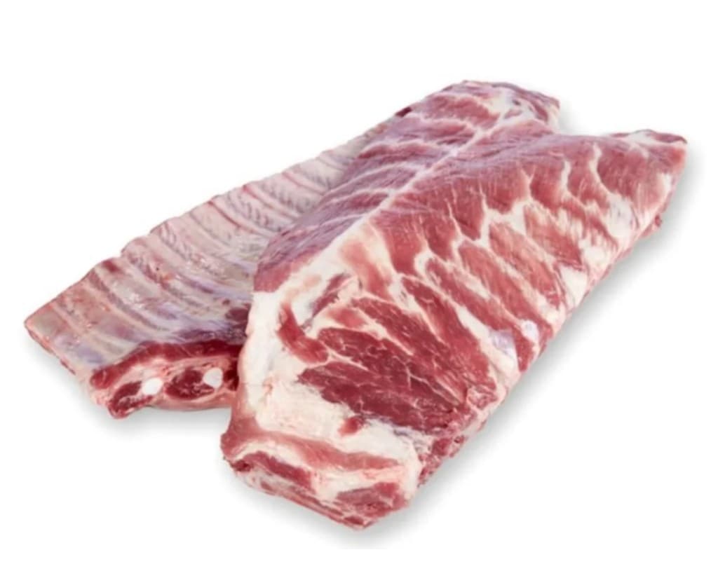 Frozen pork ribs on a white background