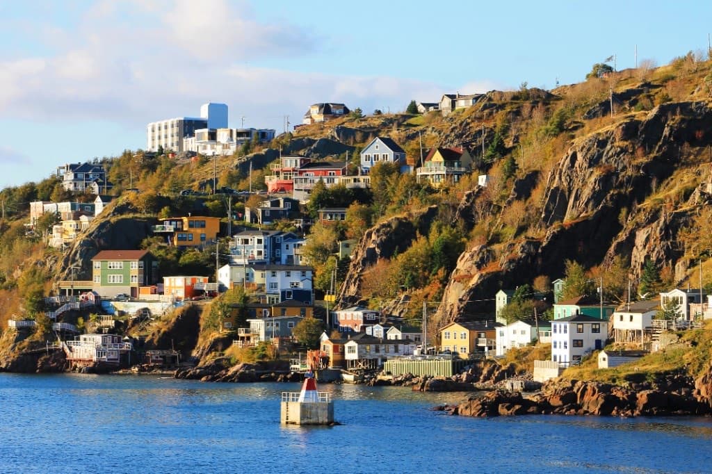 Colourful houses of The Battery climbing the hillside above St. John's harbour