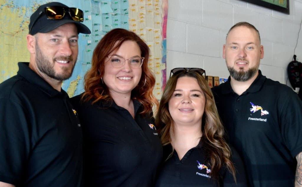 The Freezerland team wearing branded polos in the store